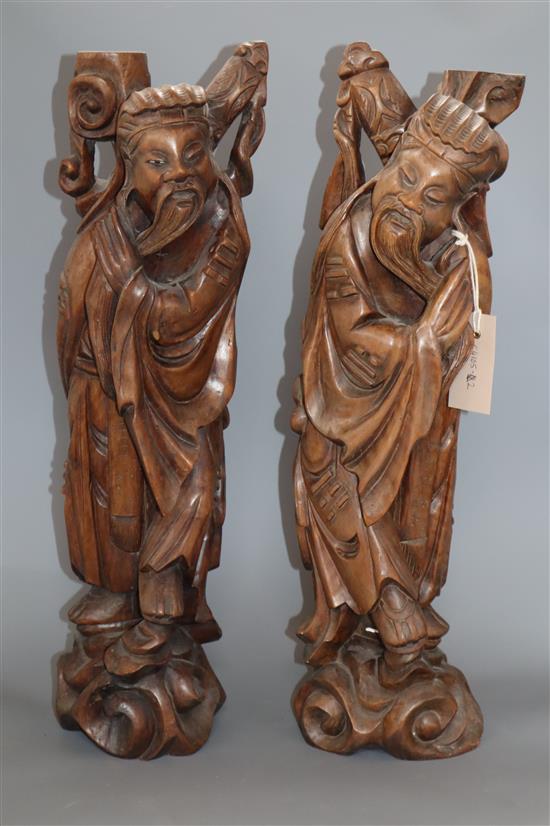 A pair of Chinese carved hardwood figures of sages height 53cm